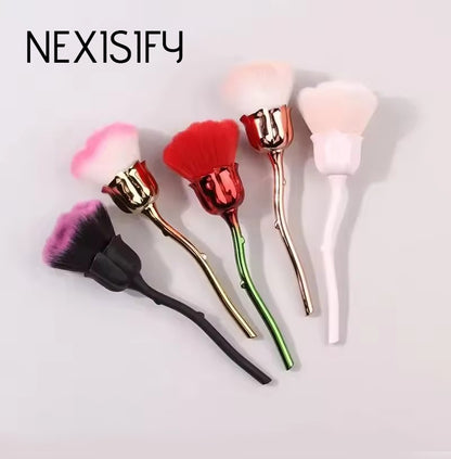 Rose gold makeup brush set with pink rose-themed bristles and gold handles